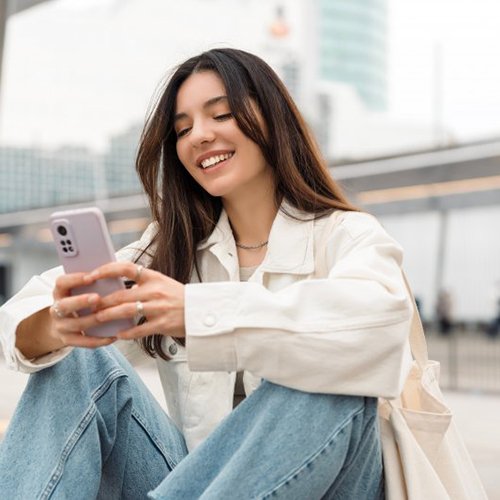 Lady reads something on smartphone