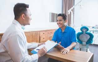 Man asking dentist about cost of cosmetic dentistry in Fair Oaks