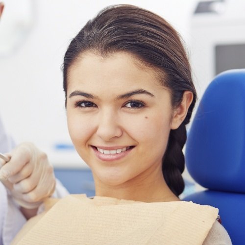 Woman smiling during oral cancer screening