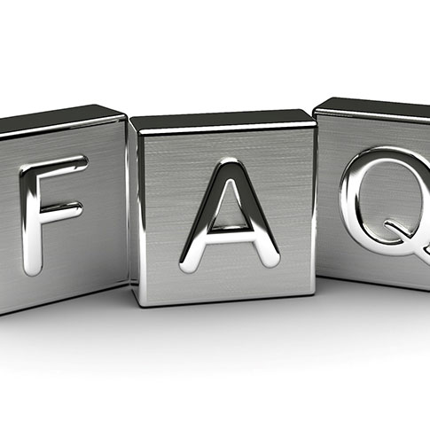 Metal block letters that spell F A Q