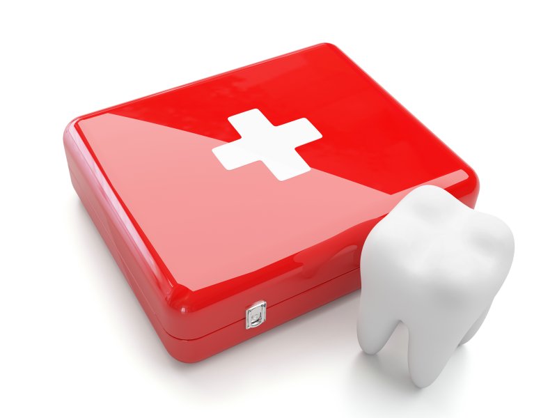 tooth sitting by a first aid kit