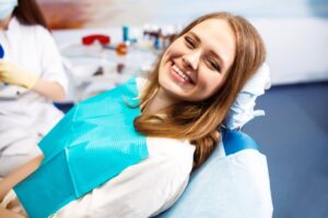 Woman smiling while at the dentist